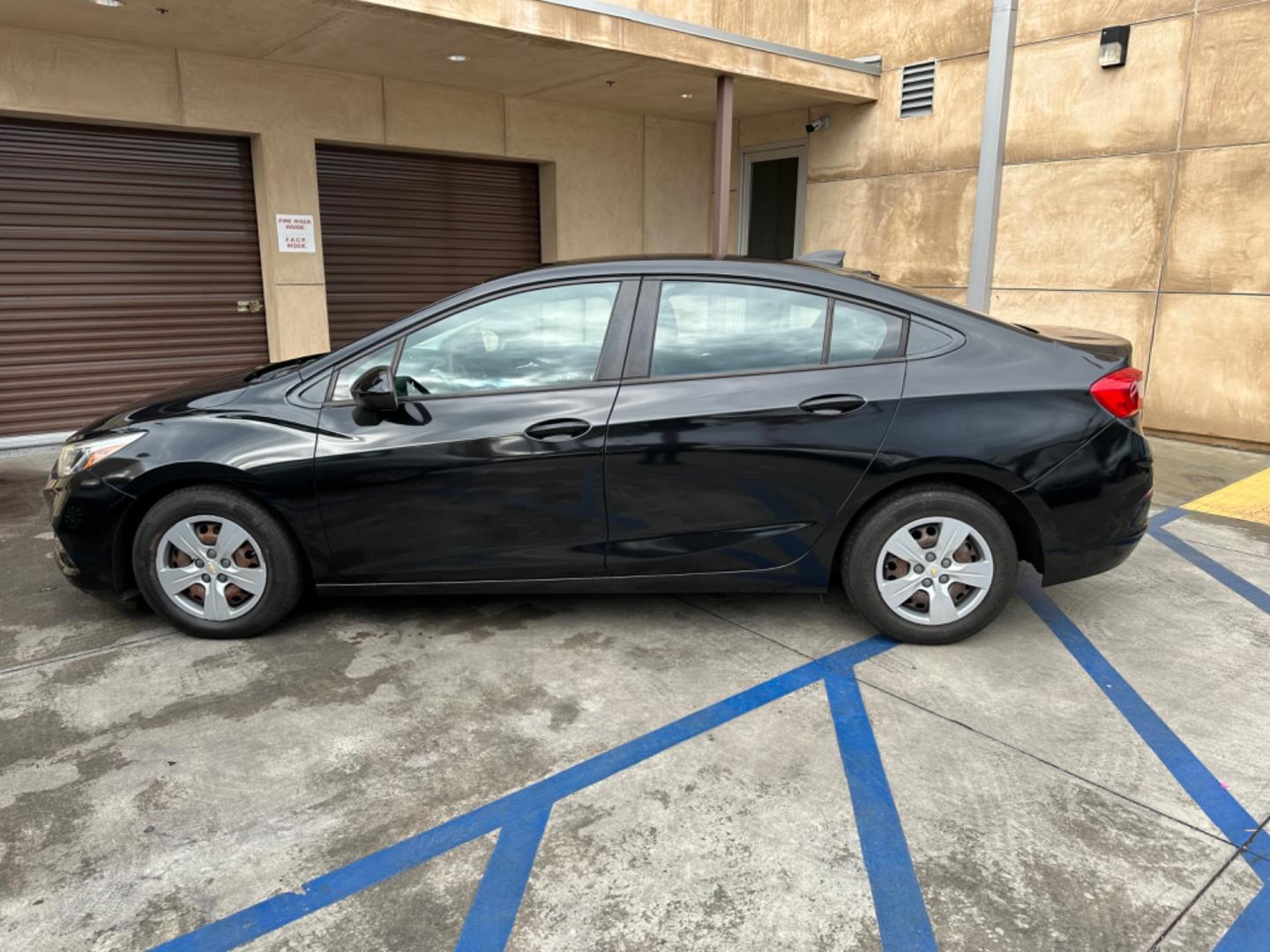 2017 Black /BLACK Chevrolet Cruze LS Auto (1G1BC5SM6H7) with an 1.4L L4 DOHC 16V TURBO engine, 6A transmission, located at 30 S. Berkeley Avenue, Pasadena, CA, 91107, (626) 248-7567, 34.145447, -118.109398 - Crown City Motors is a used “Buy Here Pay Here” car dealer in Pasadena CA. “Buy Here Pay Here” financing, means that when you purchase your vehicle from our dealership, that you make the payments to the dealership as well. We do not need the banks approval to get you approved for a used auto - Photo#1